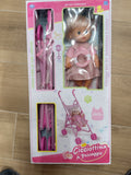 Bambola Cicciottina con passeggino rosa, set completo